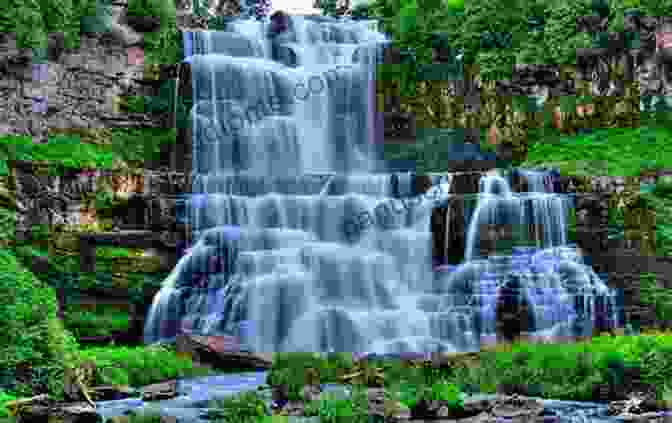 A Beautiful Waterfall Cascading Down A Mountainside, Symbolizing The Rebirth Of The Divine Within The New Polytheism: Rebirth Of The Gods And Goddesses