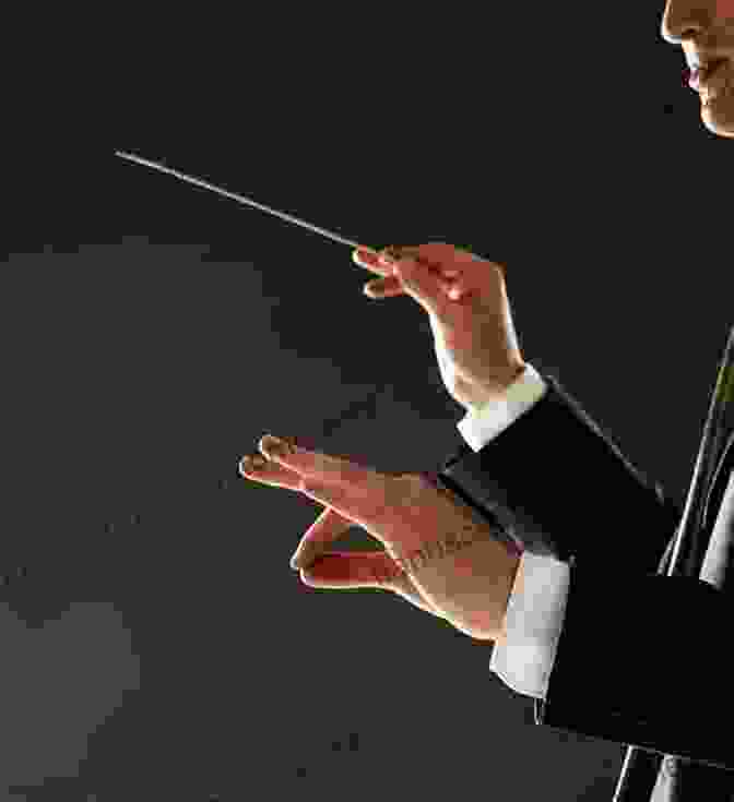 A Conductor Holding A Baton, Their Hand Delicately Poised Over A Music Score Maestros And Their Music: The Art And Alchemy Of Conducting