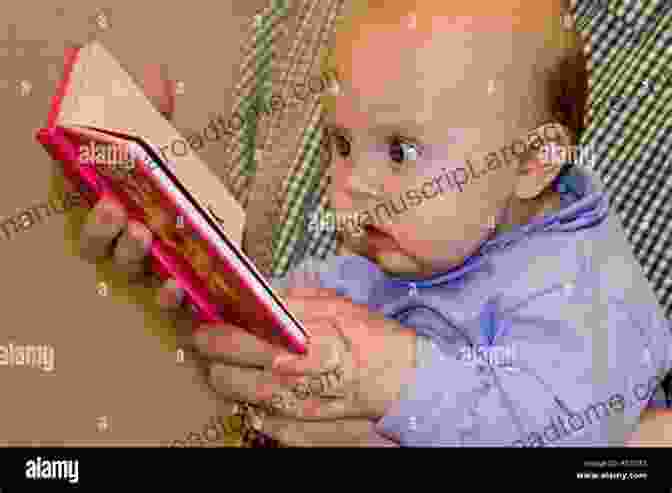 A Young Baby Engrossed In Reading 'Blooms For Babies Floral Alphabet' Blooms For Babies: A Floral Alphabet